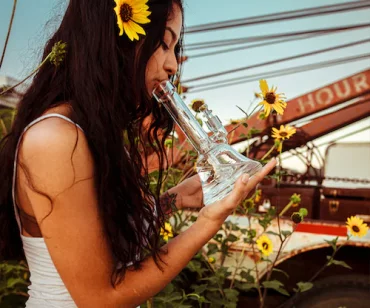 lady with sunflower on her ear